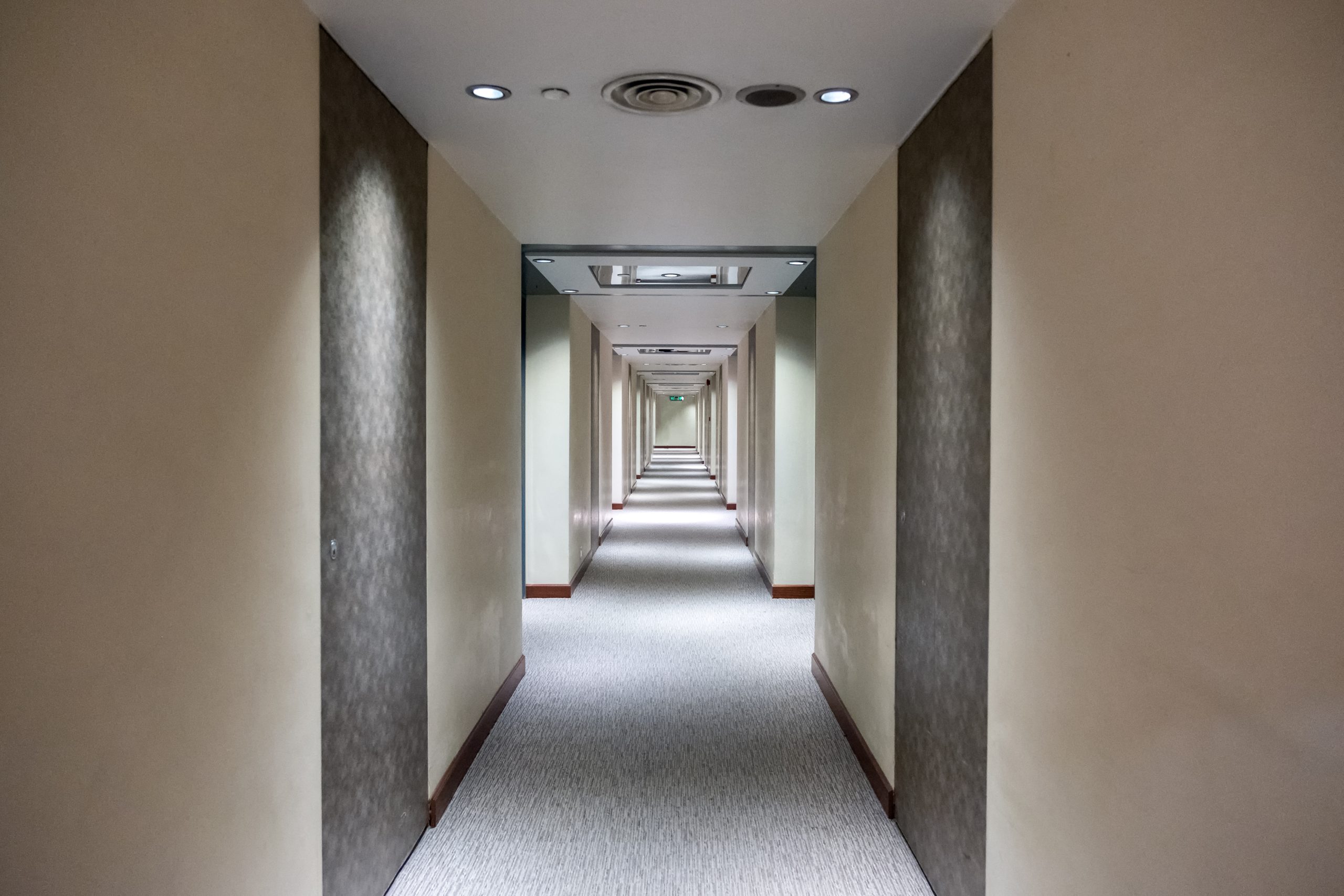 Empty corridor with closed rows door with lighting decoration